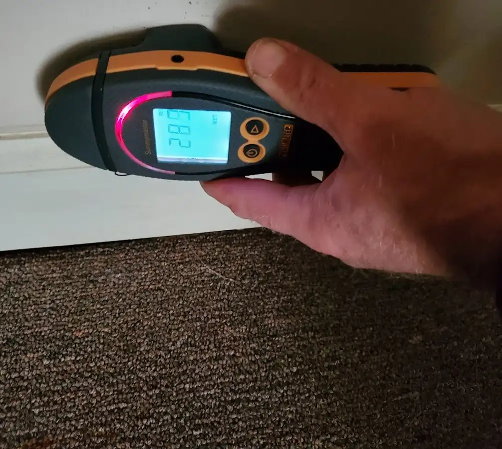 Moisture detection at baseboard during Storm Damage Restoration in Westport
